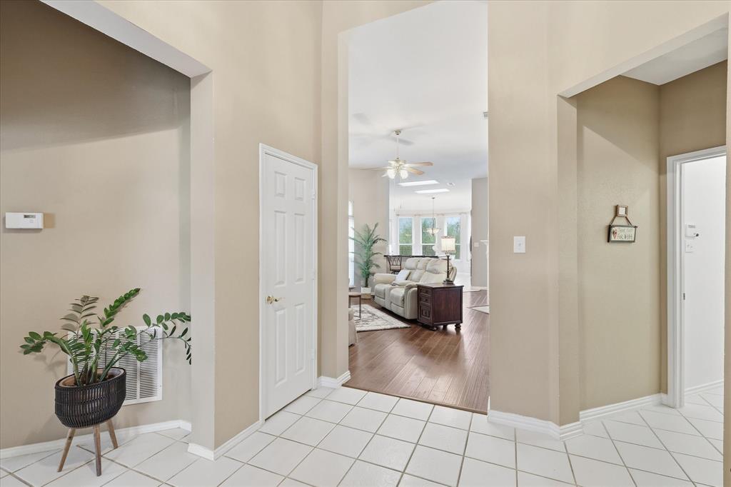 8409 Sequoia Way Fort Worth, TX 76137 - Photo 4 of 40 a view of a hallway and a livingroom with furniture