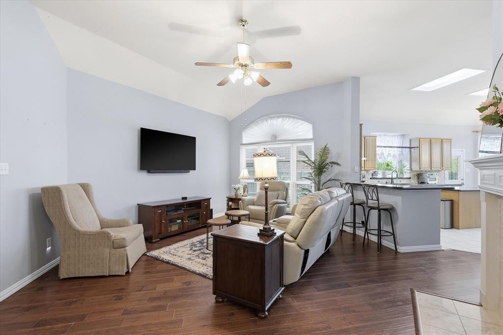 8409 Sequoia Way Fort Worth, TX 76137 - Photo 5 of 40 a living room with furniture fireplace and flat screen tv