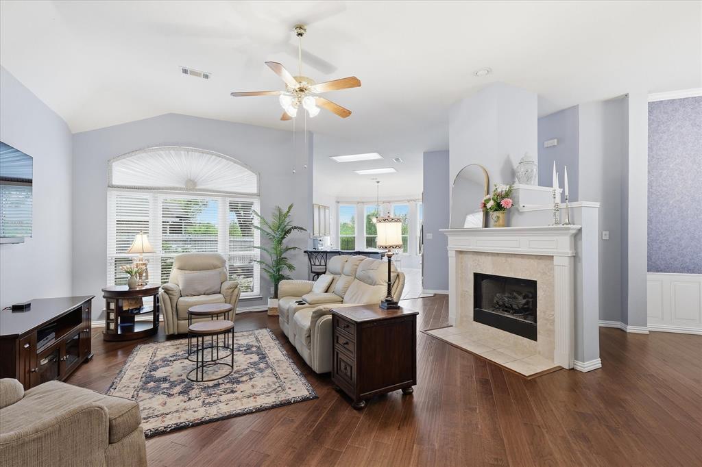 8409 Sequoia Way Fort Worth, TX 76137 - Photo 6 of 40 a living room with furniture and a fireplace