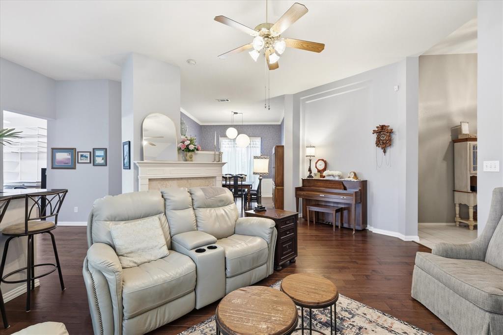 8409 Sequoia Way Fort Worth, TX 76137 - Photo 8 of 40 a living room with furniture a rug and a chandelier