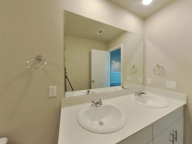 a bathroom with a toilet and a bathtub