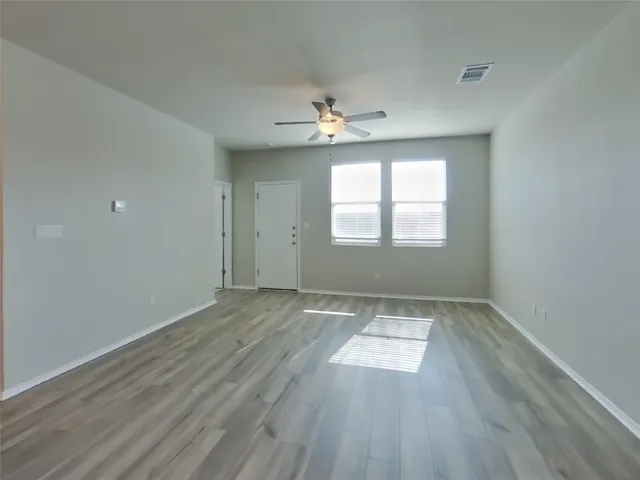 a view of kitchen with kitchen island microwave and sink