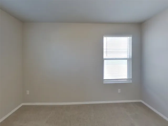 a bathroom with a shower sink and mirror