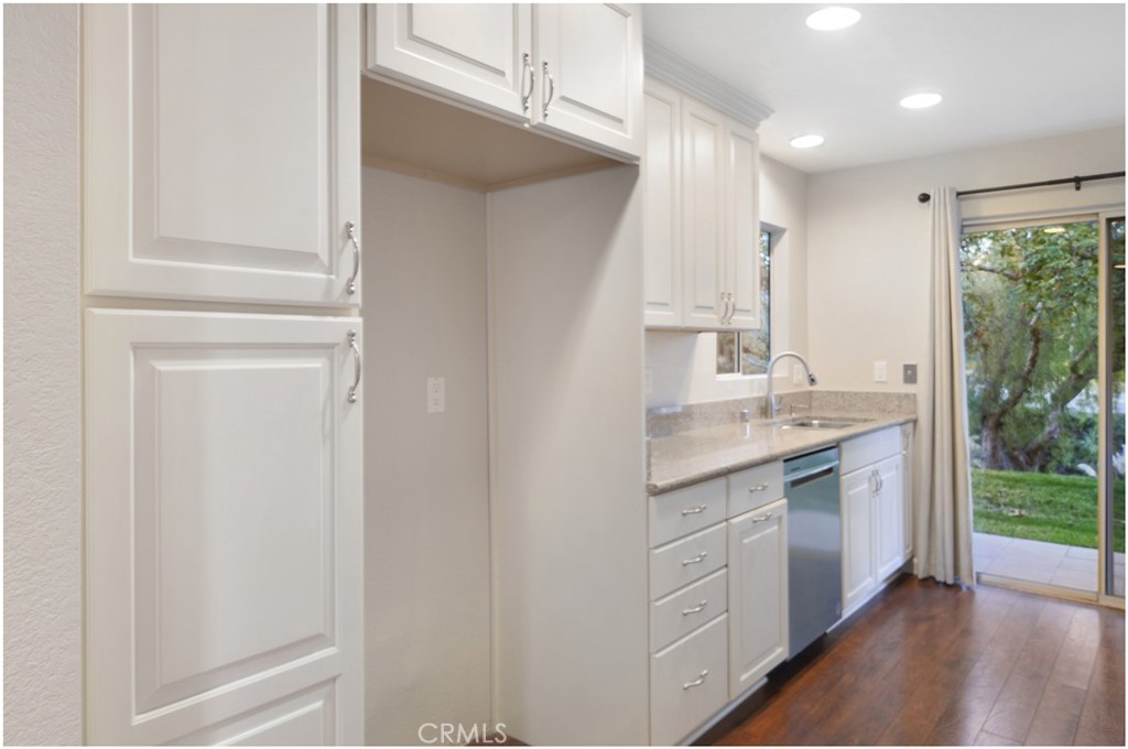 4 Corniche Drive, Unit B Dana Point, CA 92629 - Photo 13 of 41 a bathroom with a granite countertop sink a toilet and a shower