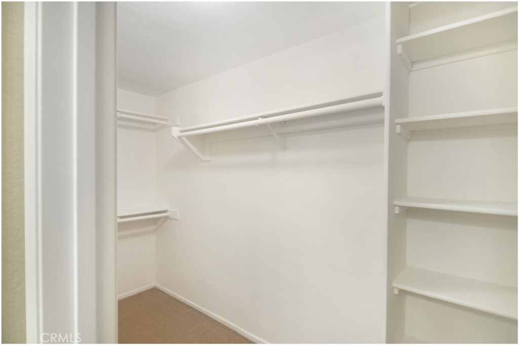 4 Corniche Drive, Unit B Dana Point, CA 92629 - Photo 18 of 41 a view of walk in closet with empty racks