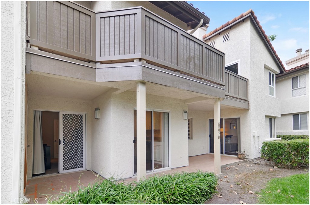 4 Corniche Drive, Unit B Dana Point, CA 92629 - Photo 21 of 41 a view of a white house with a small entryway