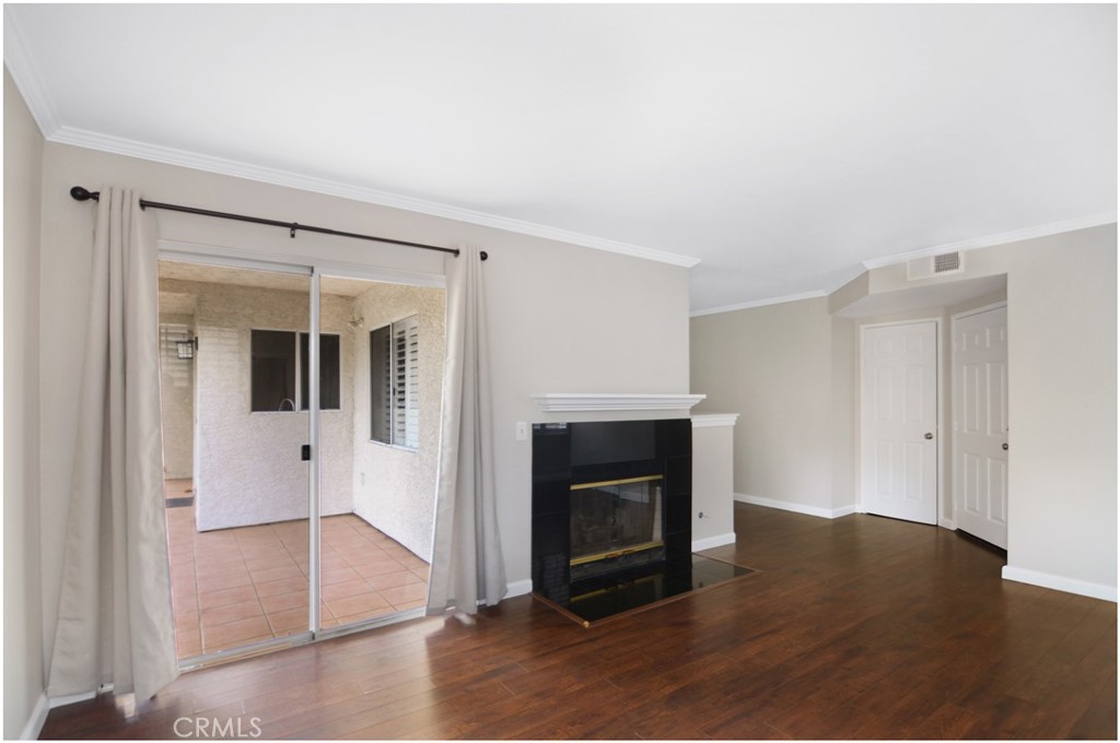4 Corniche Drive, Unit B Dana Point, CA 92629 - Photo 7 of 41 a view of an empty room with wooden floor and a window