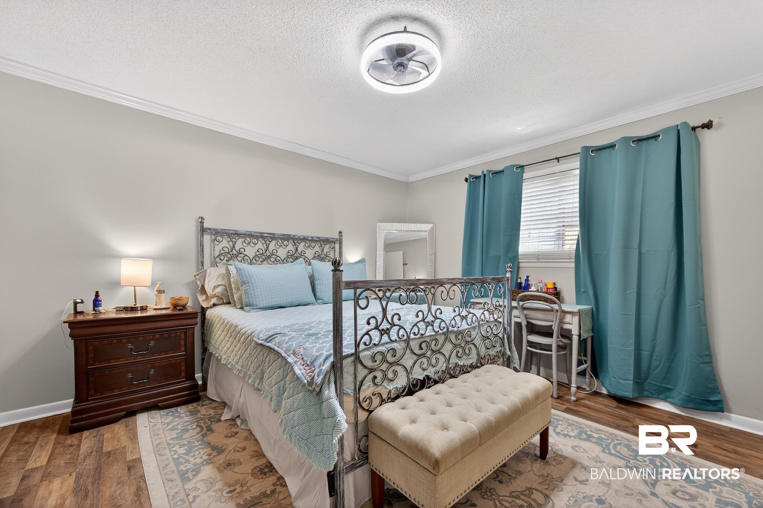 46006 Pecan Lane Bay Minette, AL 36507 - Photo 26 of 40 Bedroom featuring wood finished floors, crown molding, and a textured ceiling
