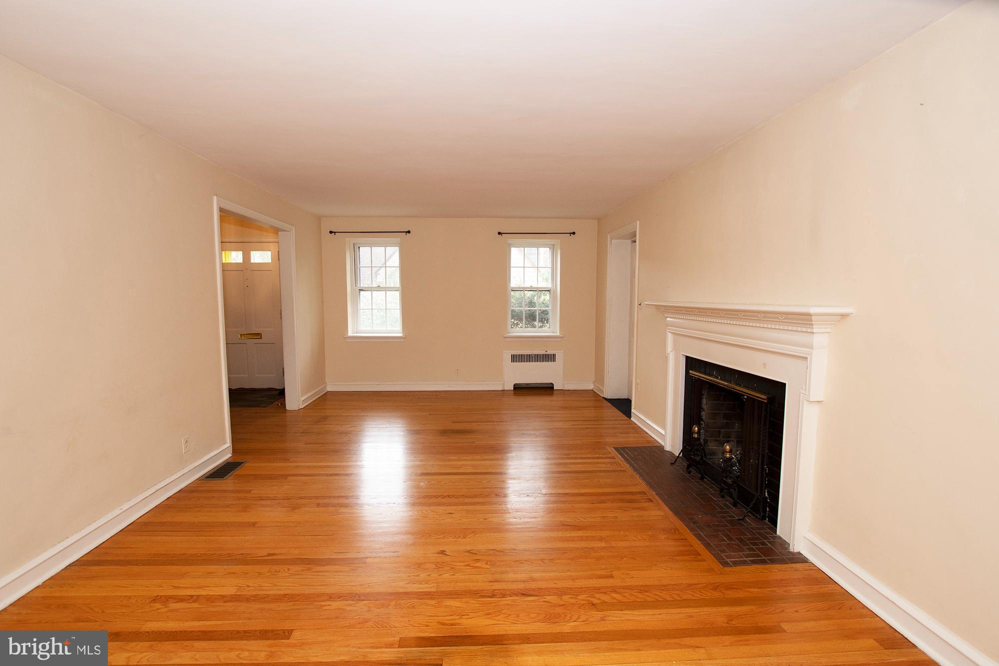631 Parrish Road Swarthmore, PA 19081 - Photo 6 of 44 Living room with Hw floors and FP