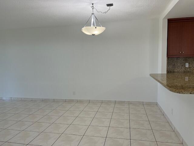 5500 Northwest 2nd Avenue, Unit 123 Boca Raton, FL 33487 - Photo 12 of 48 a view of a kitchen with dishwasher and white cabinets