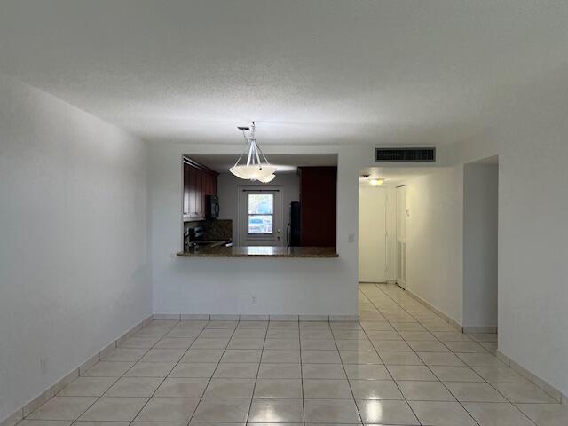 5500 Northwest 2nd Avenue, Unit 123 Boca Raton, FL 33487 - Photo 13 of 48 a view of a livingroom with a kitchen