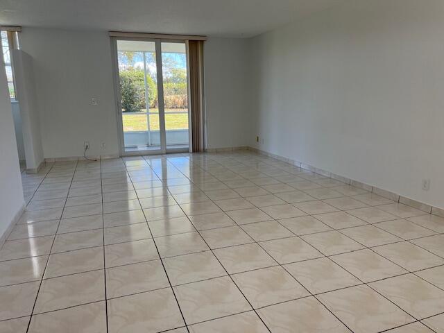 5500 Northwest 2nd Avenue, Unit 123 Boca Raton, FL 33487 - Photo 9 of 48 a view of an empty room and window