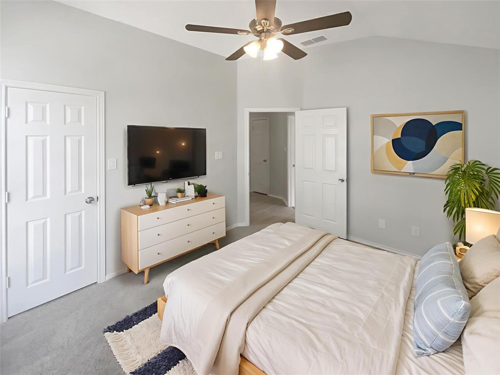 3724 Tulip Tree Drive Fort Worth, TX 76137 - Photo 14 of 30 a bedroom with a bed and a flat screen tv