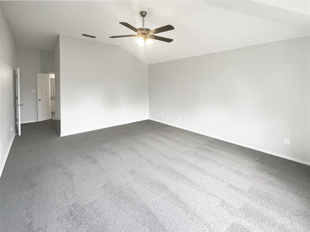 3724 Tulip Tree Drive Fort Worth, TX 76137 - Photo 22 of 30 an empty room with a ceiling fan and a window