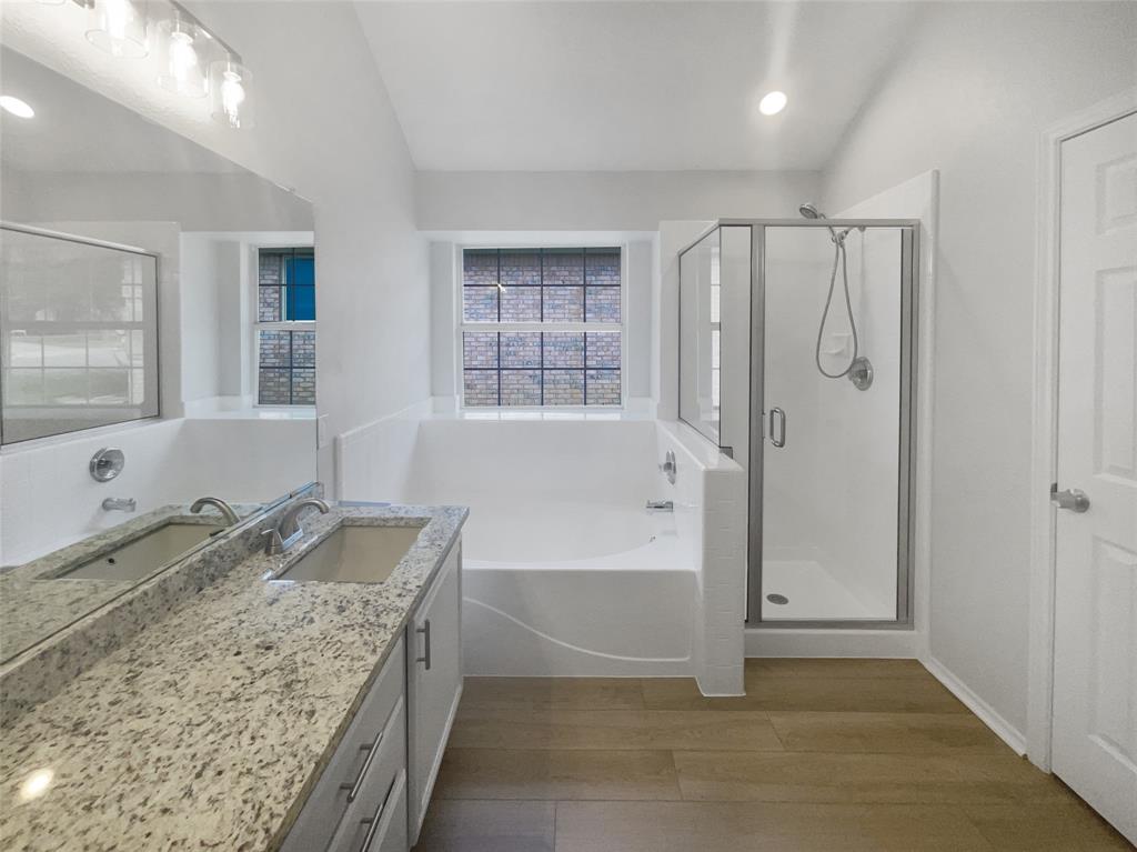 3724 Tulip Tree Drive Fort Worth, TX 76137 - Photo 24 of 30 a bathroom with granite countertop a tub sink and mirror