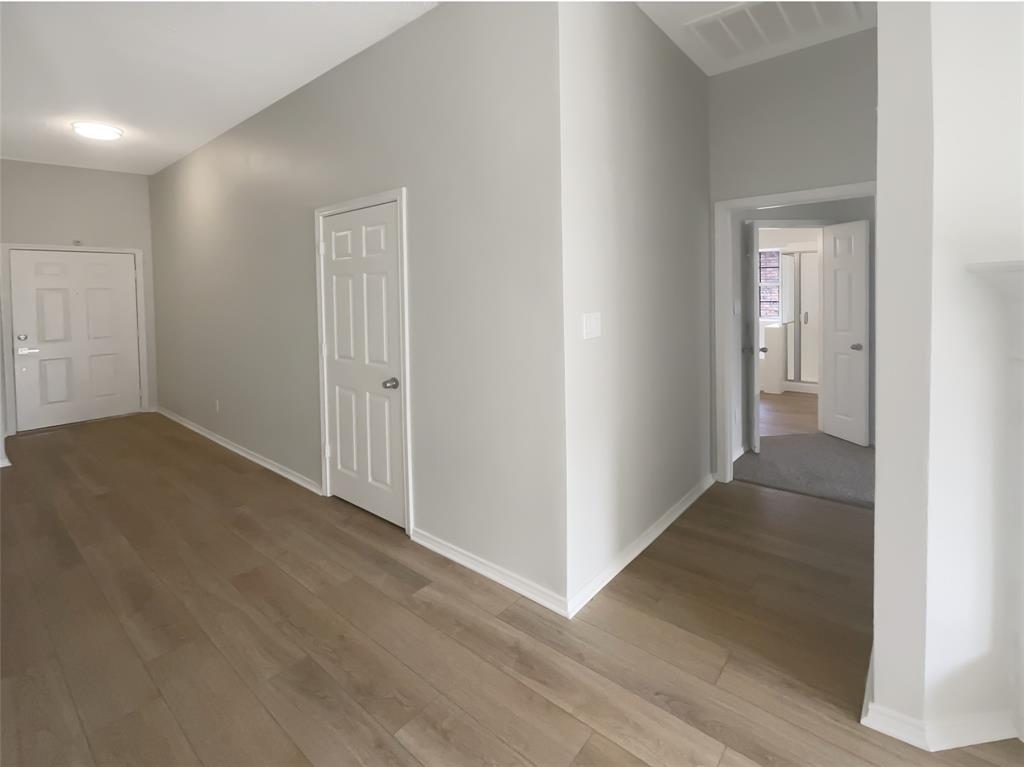 3724 Tulip Tree Drive Fort Worth, TX 76137 - Photo 25 of 30 an empty room with wooden floor and windows