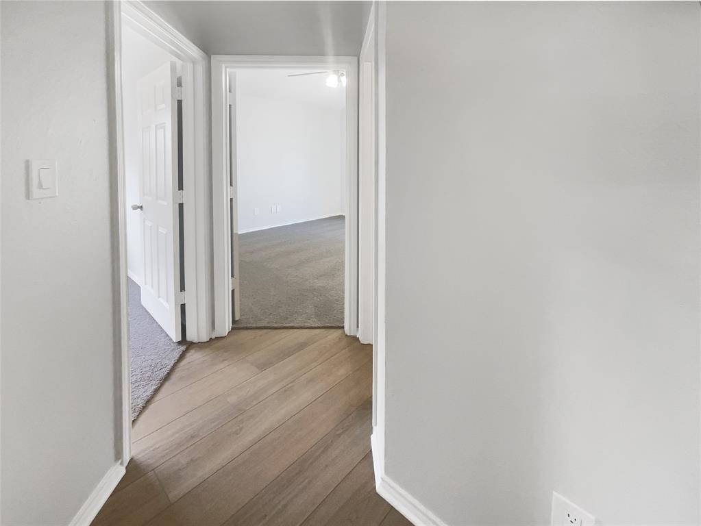 3724 Tulip Tree Drive Fort Worth, TX 76137 - Photo 26 of 30 a view of a hallway with wooden floor