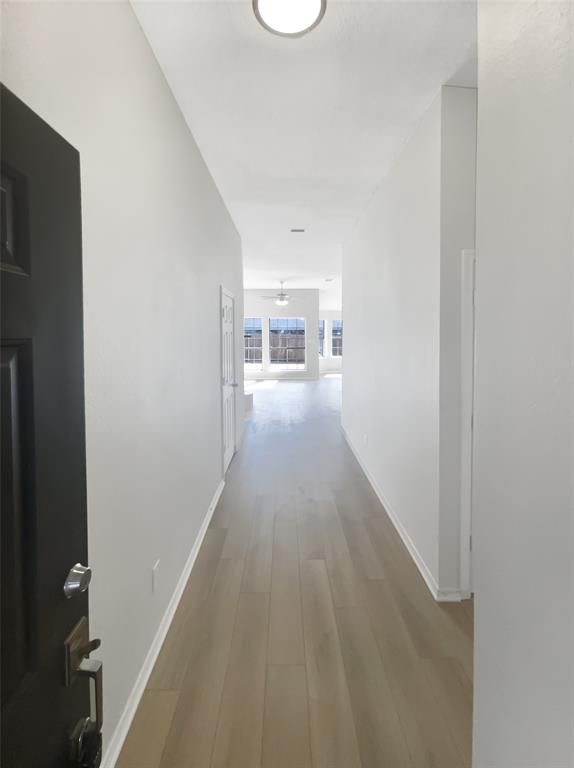 3724 Tulip Tree Drive Fort Worth, TX 76137 - Photo 27 of 30 a view of a hallway with wooden floor and a living room