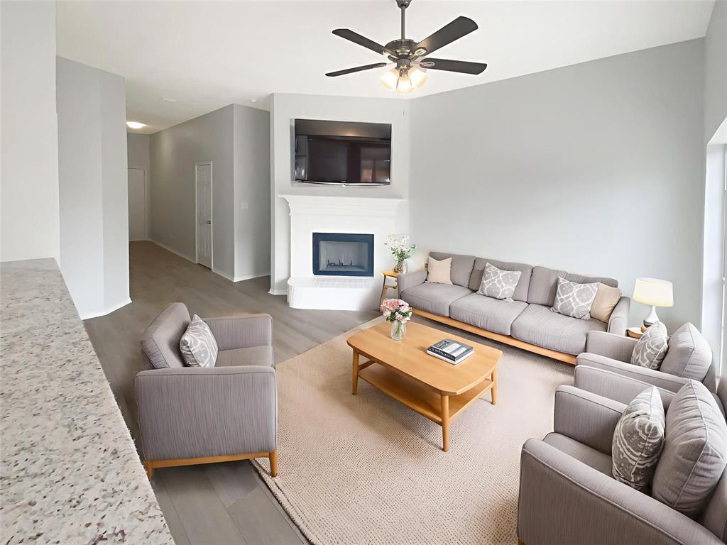 3724 Tulip Tree Drive Fort Worth, TX 76137 - Photo 10 of 30 a living room with furniture and a fireplace