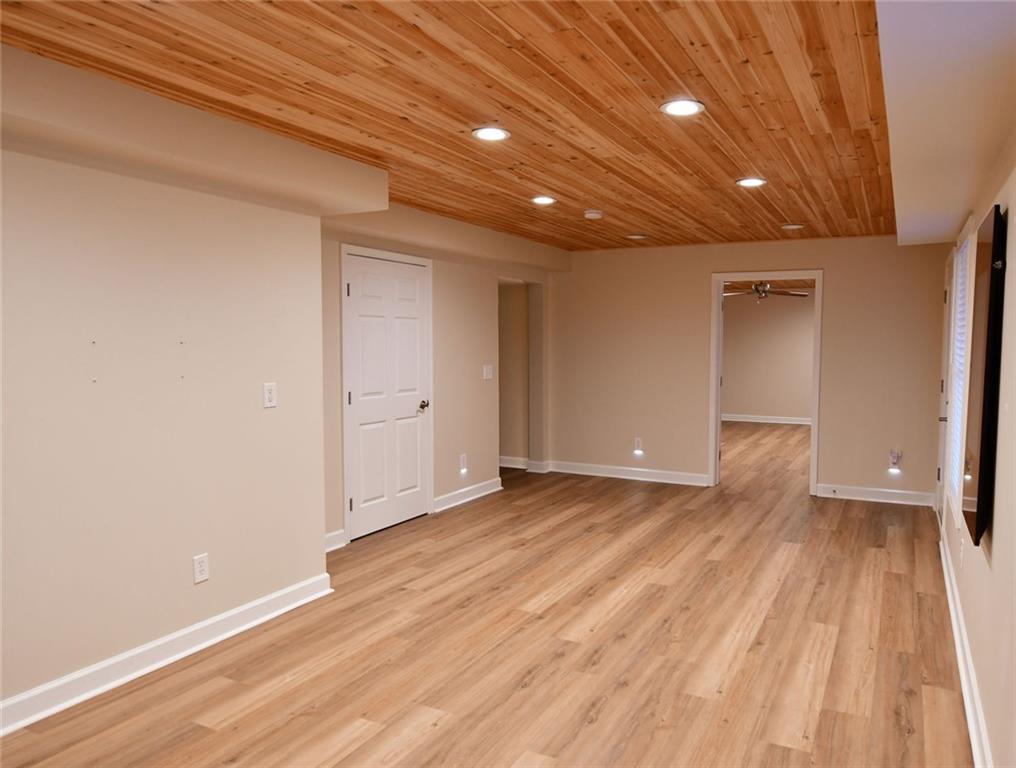 1767 Honey Tree Place Hoschton, GA 30548 - Photo 20 of 54 a view of an empty room with wooden floor