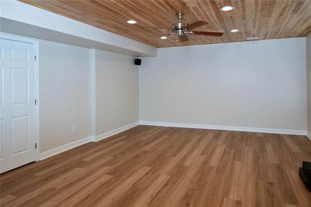 1767 Honey Tree Place Hoschton, GA 30548 - Photo 26 of 54 a view of an empty room with wooden floor