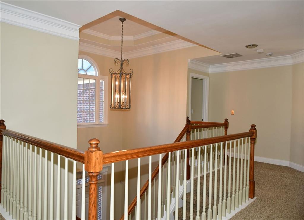 1767 Honey Tree Place Hoschton, GA 30548 - Photo 32 of 54 a view of a hallway with windows