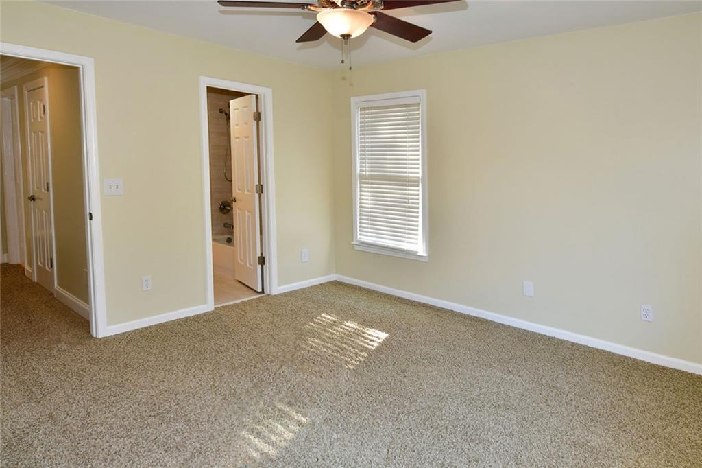 1767 Honey Tree Place Hoschton, GA 30548 - Photo 42 of 54 a view of an empty room with a window