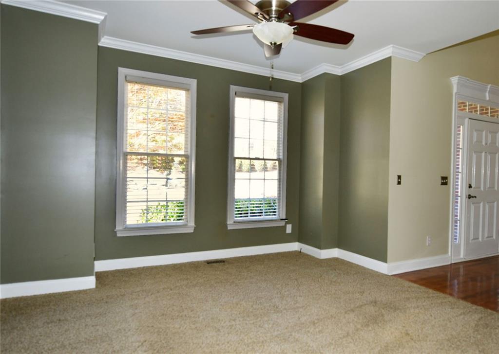 1767 Honey Tree Place Hoschton, GA 30548 - Photo 5 of 54 a view of an empty room with a window