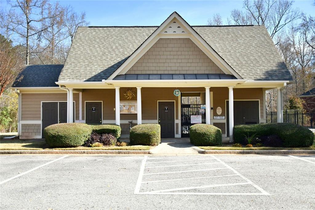 1767 Honey Tree Place Hoschton, GA 30548 - Photo 51 of 54 front view of a brick house with a yard