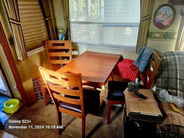 a dinning table and chairs in a patio