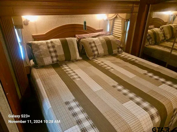 a bedroom with a bed and a walk in closet