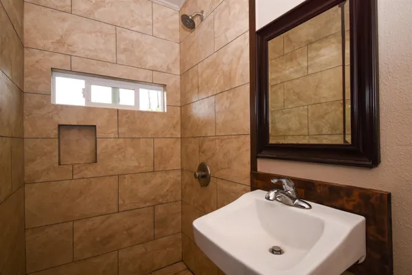 a bathroom with a sink and a mirror