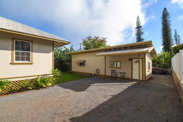 a view of a house with a yard and garage