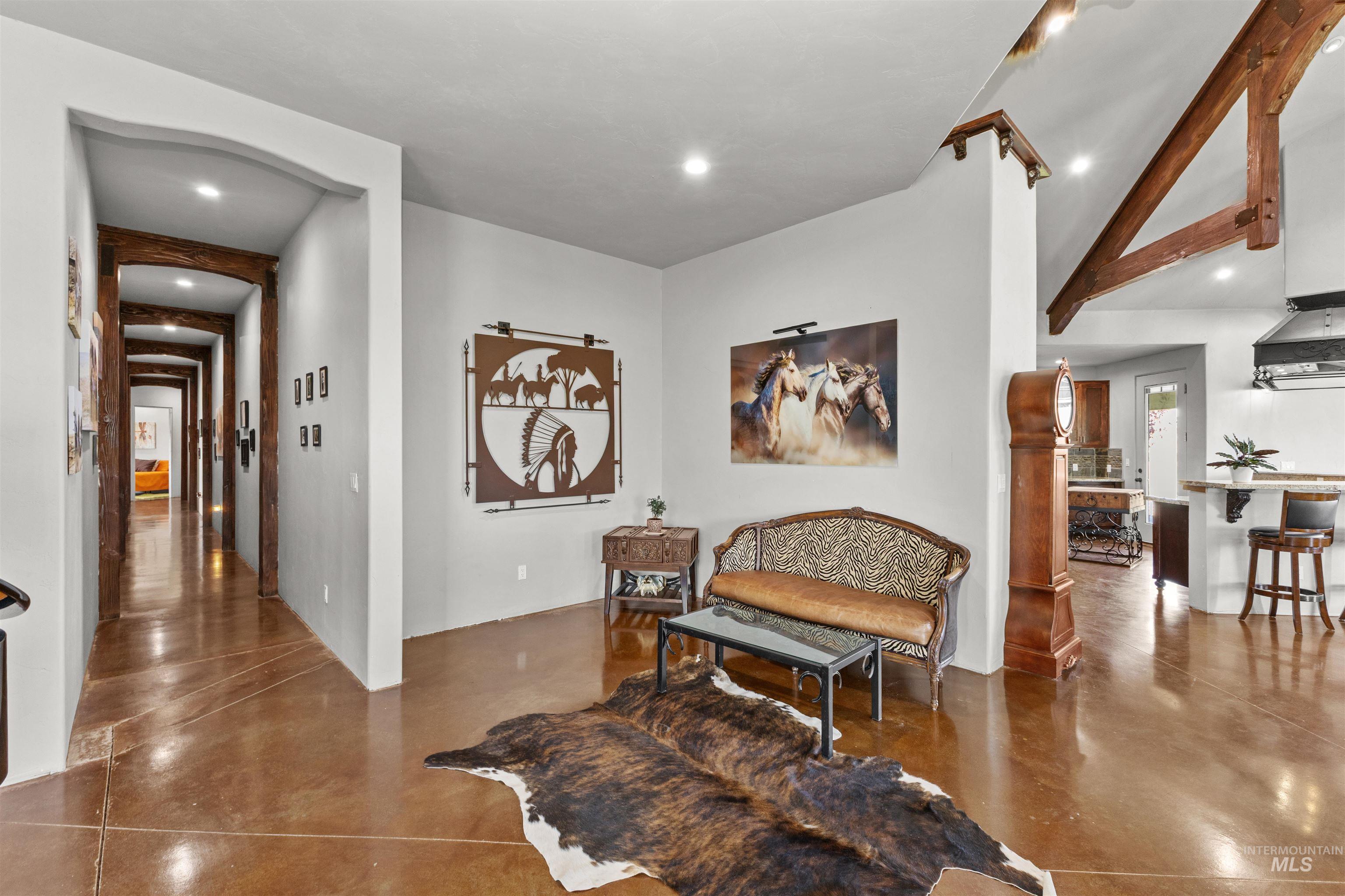 1030 Desert Glen Road Adrian, OR 97901 - Photo 16 of 47 Spacious interior featuring exposed wooden beams and rich wood-finish flooring