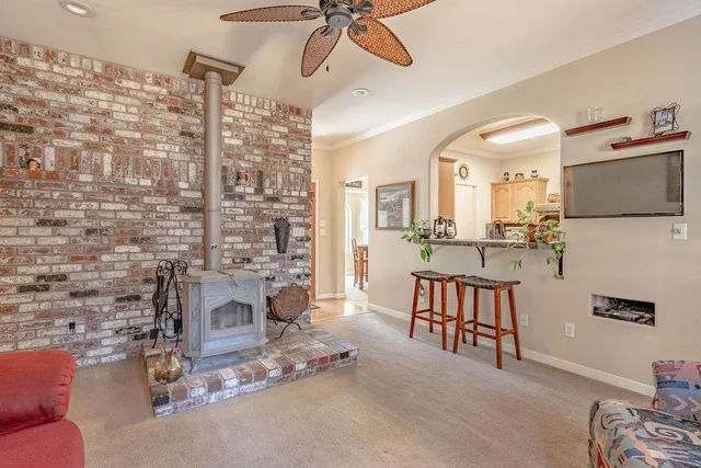 a dining room with furniture and a fireplace