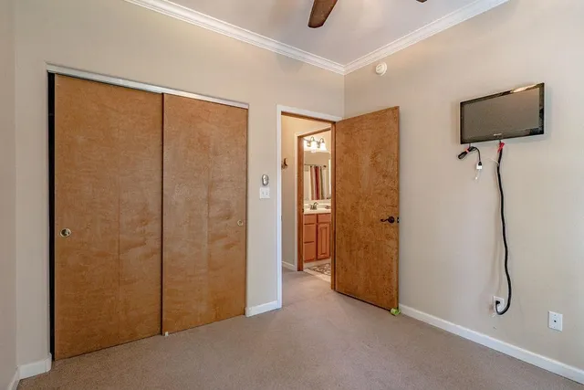 a view of empty room with projector and wall