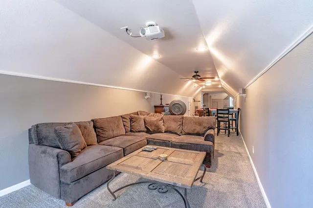 a room with furniture and air hockey table