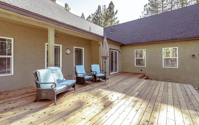 a living room filled with furniture window and a table