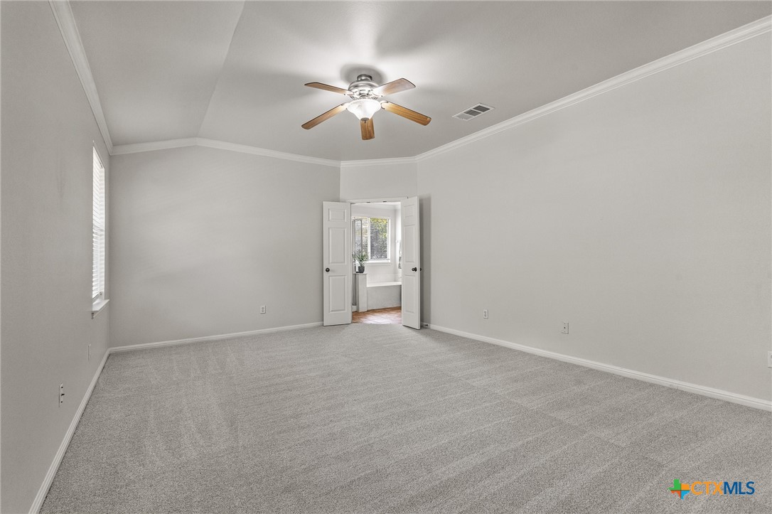7733 Little Deer Trail Georgetown, TX 78628 - Photo 18 of 36 a view of an empty room with a fan