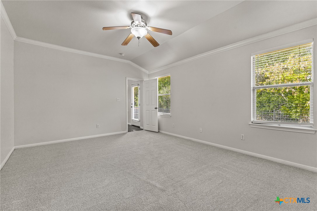 7733 Little Deer Trail Georgetown, TX 78628 - Photo 20 of 36 an empty room with windows and fan