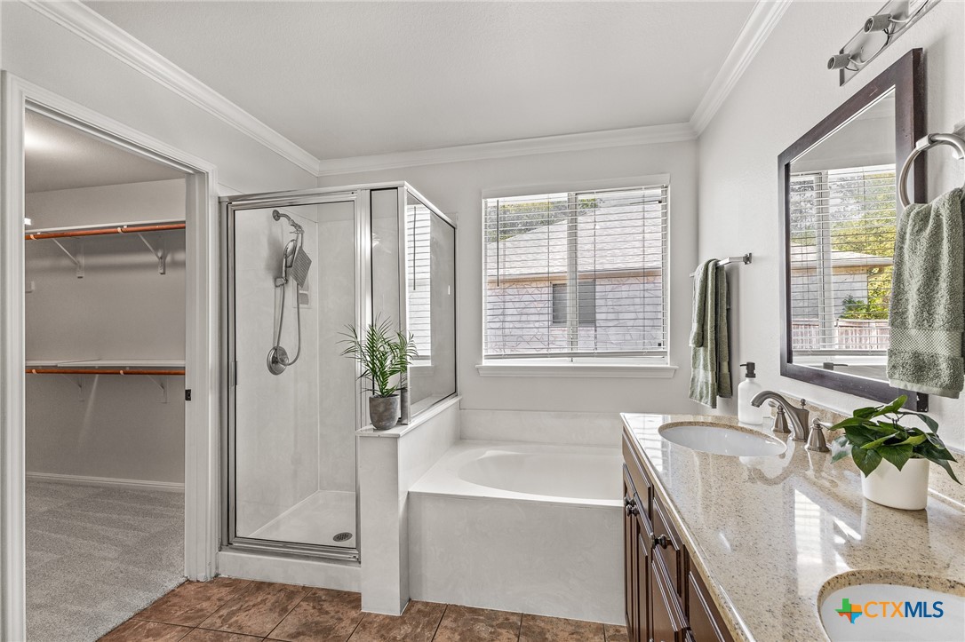 7733 Little Deer Trail Georgetown, TX 78628 - Photo 23 of 36 a bath room with a bath tub and a shower
