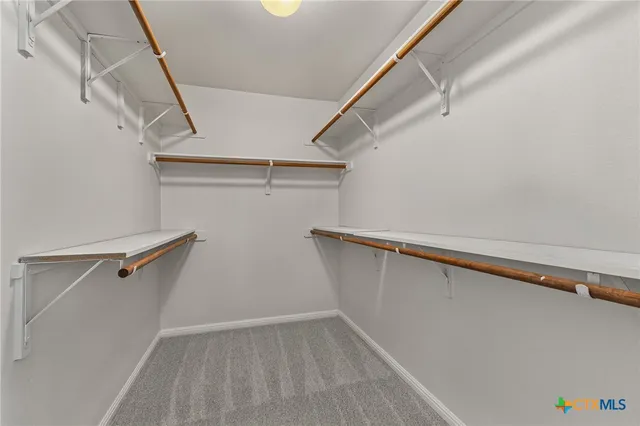 a view of a room with racks on the wall