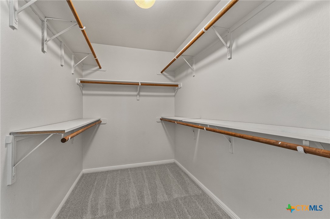 7733 Little Deer Trail Georgetown, TX 78628 - Photo 24 of 36 a view of a room with racks on the wall