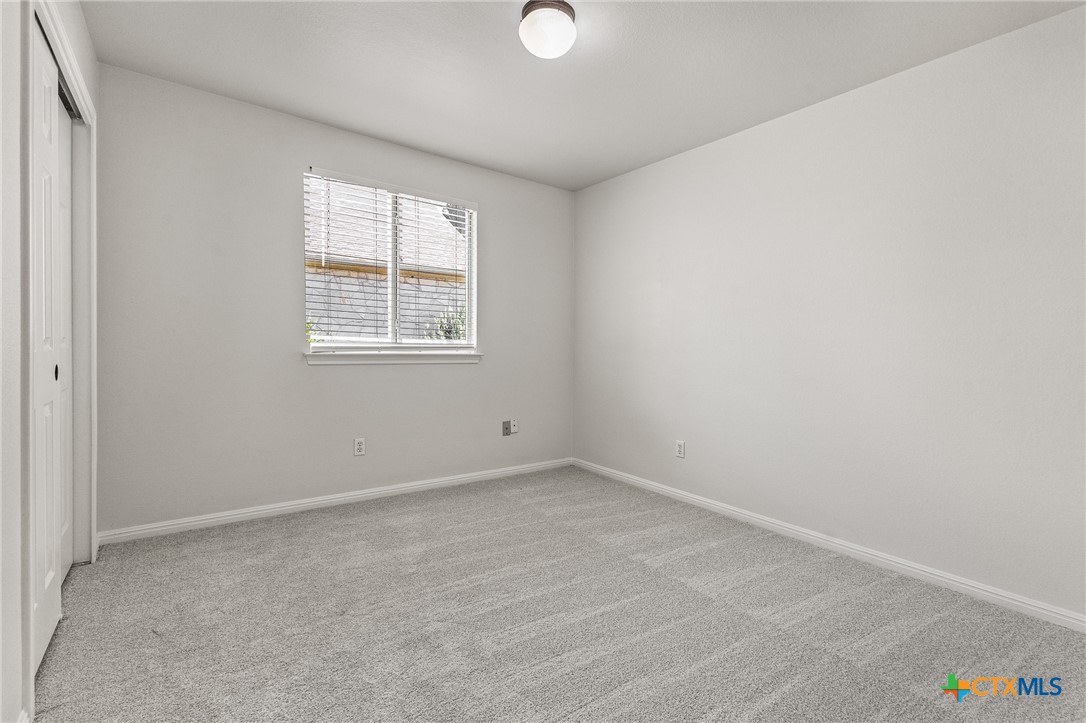 7733 Little Deer Trail Georgetown, TX 78628 - Photo 32 of 36 an empty room with a window
