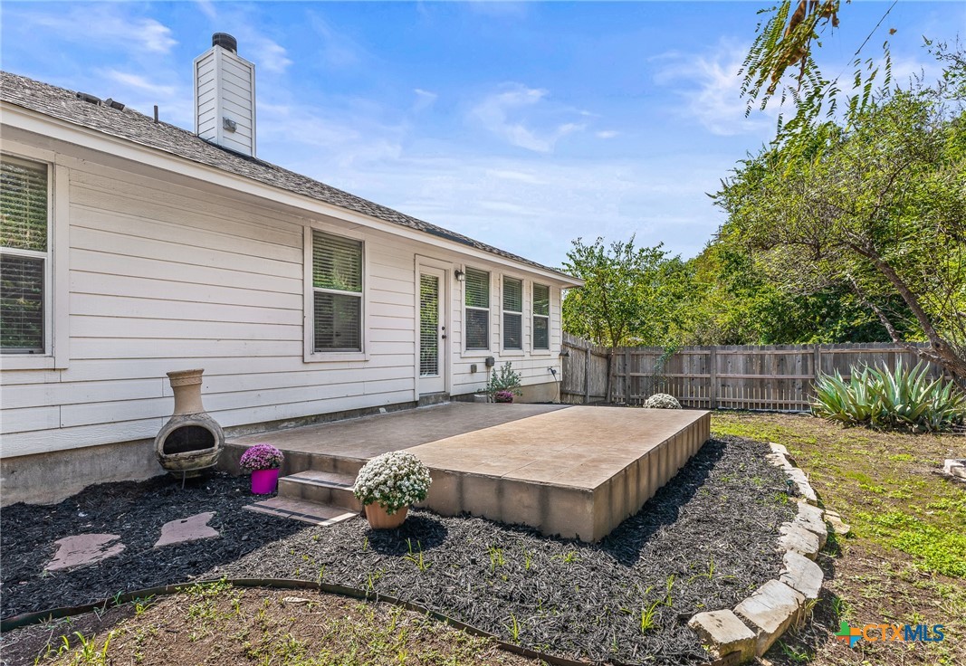 7733 Little Deer Trail Georgetown, TX 78628 - Photo 34 of 36 a view of a backyard with sitting area