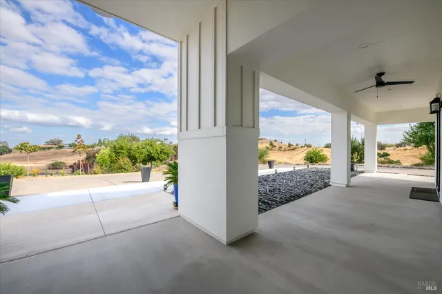 a large kitchen with stainless steel appliances lots of counter space and wooden floor