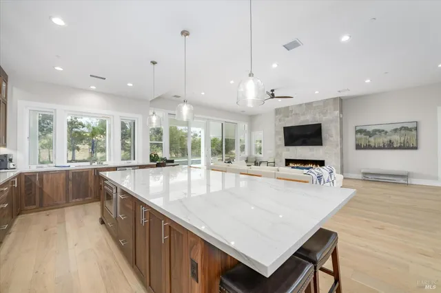 a spacious bedroom with a bed and a flat screen tv