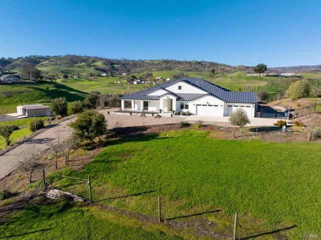 an aerial view of a house with a garden
