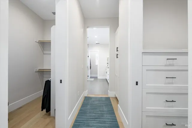 a living room with furniture a flat screen tv and a large window