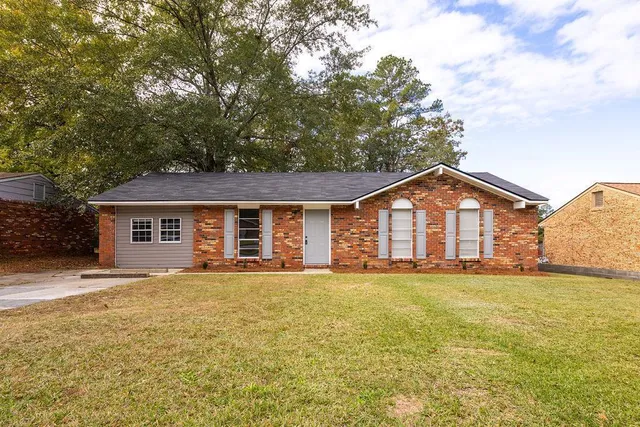 front view of a house with a yard